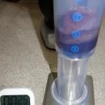 Inverted AeroPress on a scale measuring 50.29 grams.