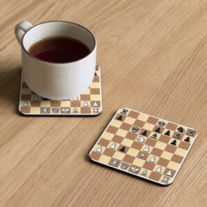 Coffee cup sitting on top of one of two Gambit Coffee chess puzzle coasters.