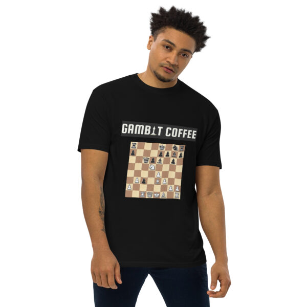 Man wearing a black Gambit Coffee chess puzzle T-Shirt.