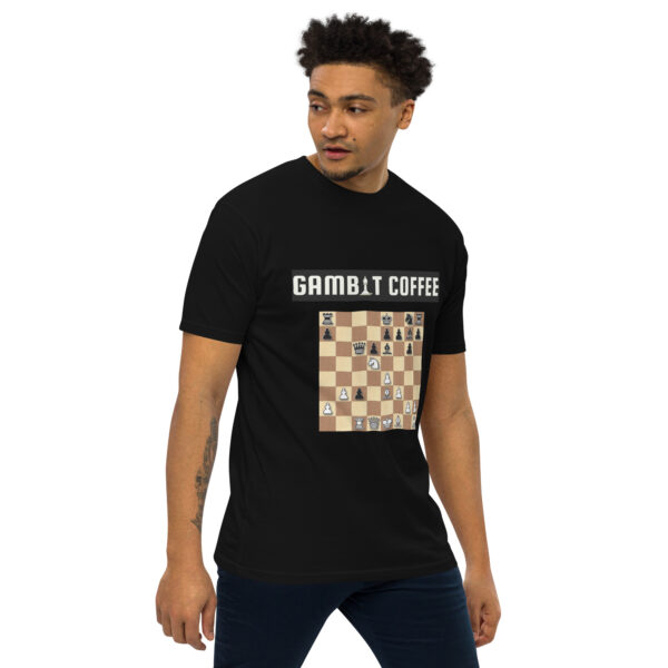 Man wearing a black Gambit Coffee chess puzzle T-Shirt.