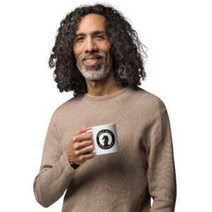 Man holding a white Gambit Coffee coffee mug.