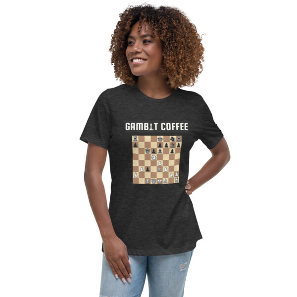 Woman wearing a black Gambit Coffee chess puzzle T-Shirt.