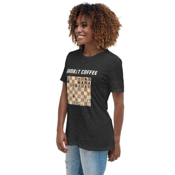 Woman wearing a black Gambit Coffee chess puzzle T-Shirt.